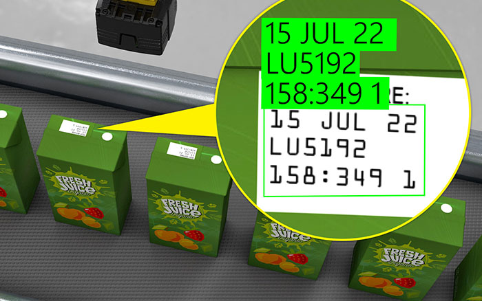 Cognex vision sensor performing optical character recognition (OCR) on juice boxes 